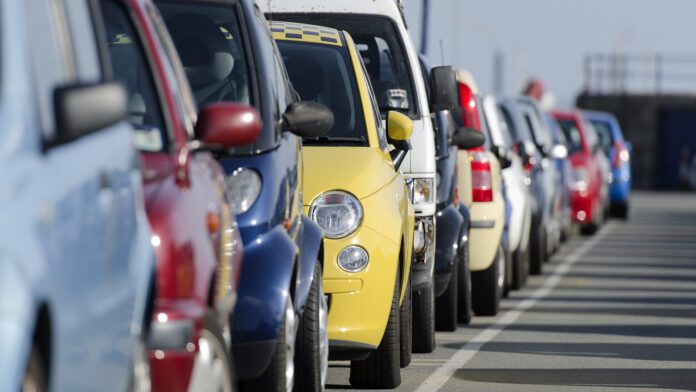 Multi colored cars parking in a row